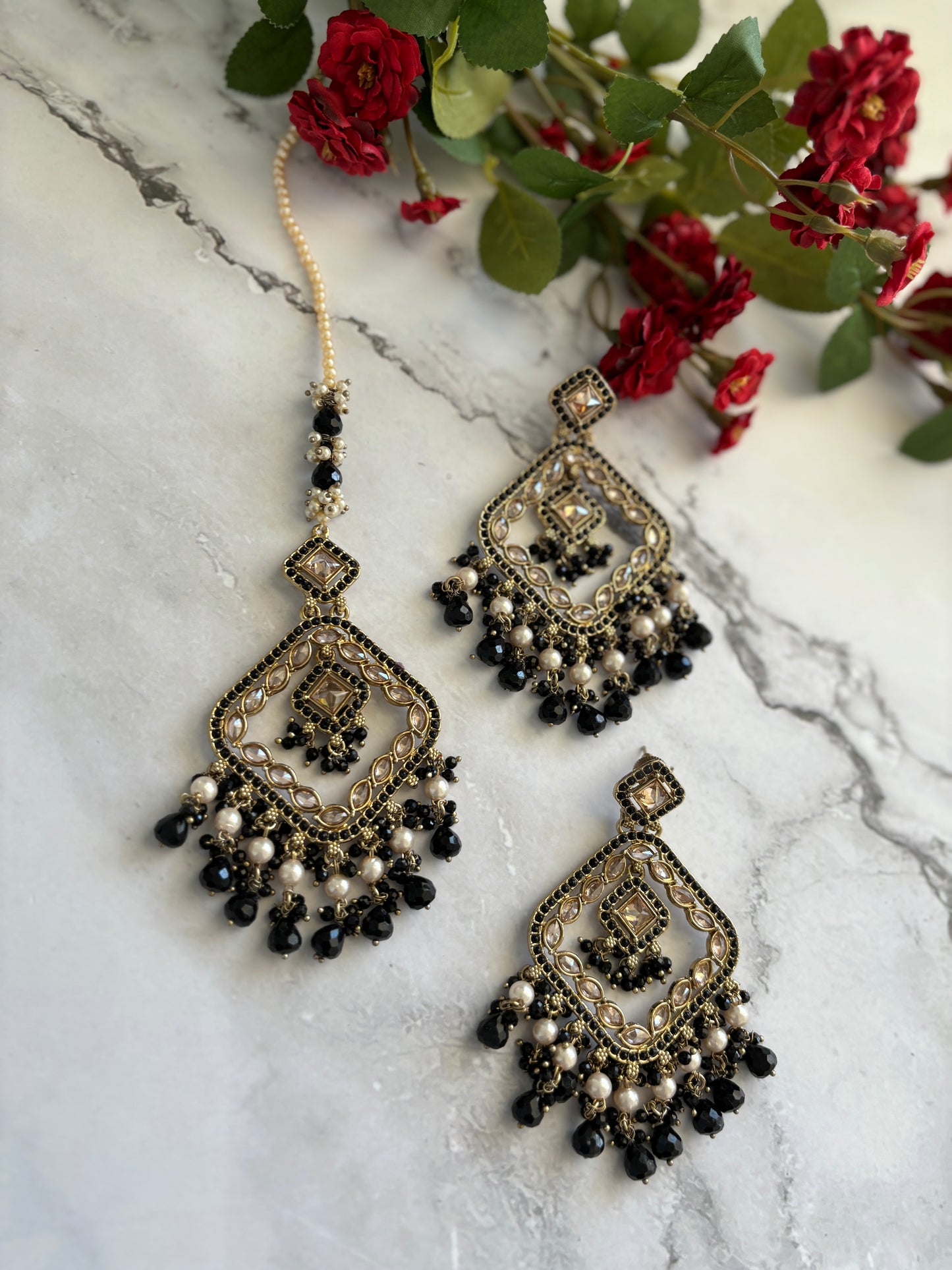 Black polki earrings and tikka